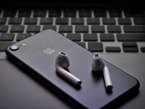 Apple Macbook, iPhone and Earbuds
